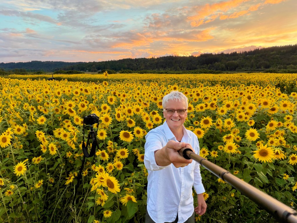 Landscape photographer Erwin Buske standing in a sunflower field in Duvall, Washington.